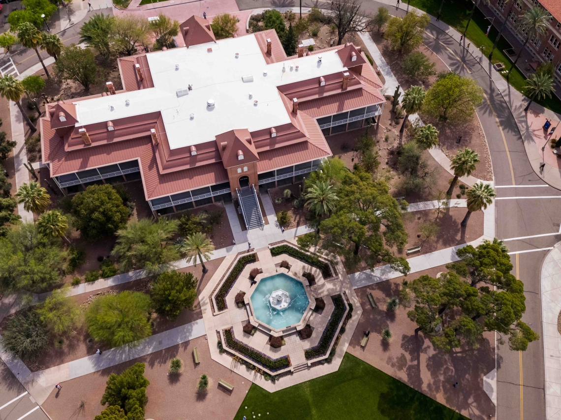 Aerial shot over Old Main building with view of the fountain Aerial shot over Old Main building with view of the fountain