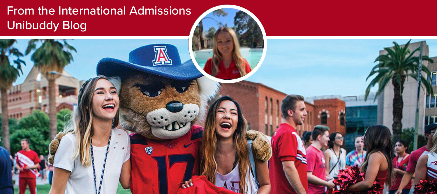 Two students on the University of Arizona Mall with mascot Wilbur Wildcat