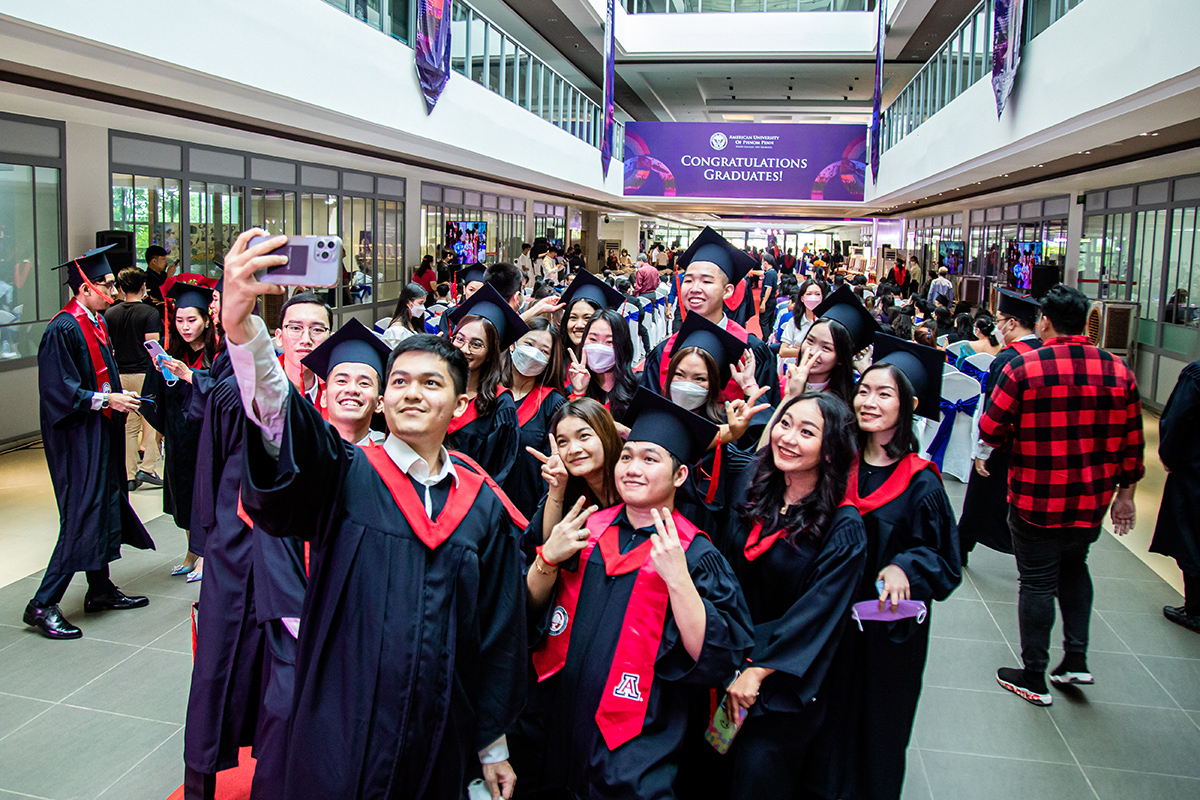 Group of graduates taking a selfie at the UArizona AUPP Graduation Ceremony June 2022