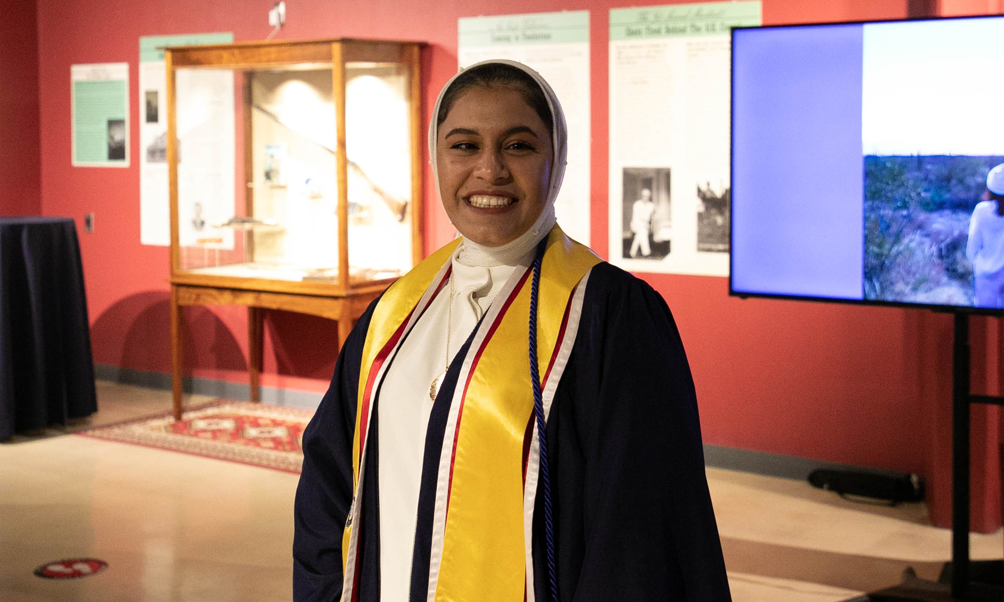 UArizona Intl Students Visitors Recep - female student w/graduation robe, stoles, head covering