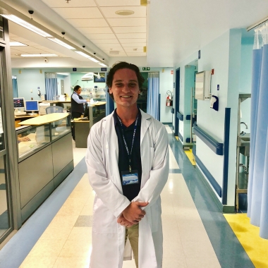 UA Study Abroad Student Brenden Barness at his hospital internship in Costa Rica, hospital hallway behind him.