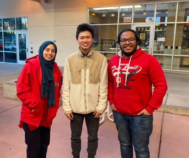 UArizona International students - a female on the left and two males to the right - at the Feb 2022 Coffee at Global event at the Global Center