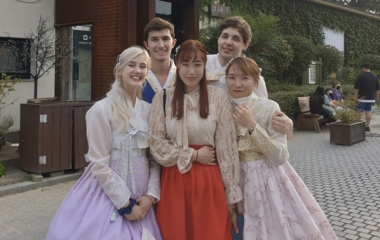Luke and 4 other students - one other male and 3 females - dressed in traditional clothing in S. Korea. 
